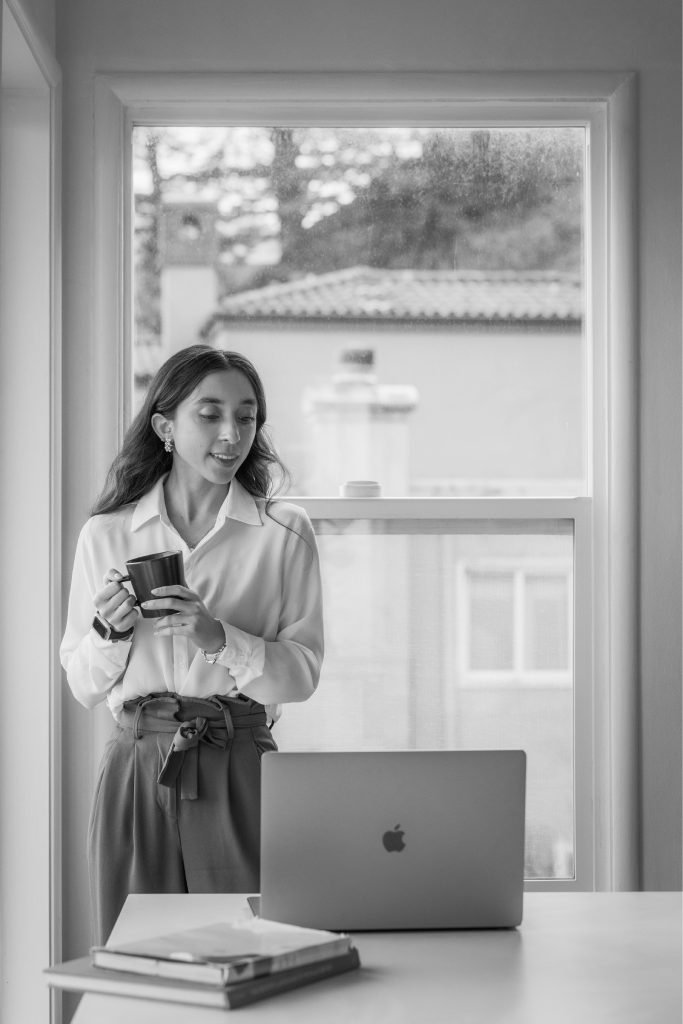 Madelynne standing beside a workspace