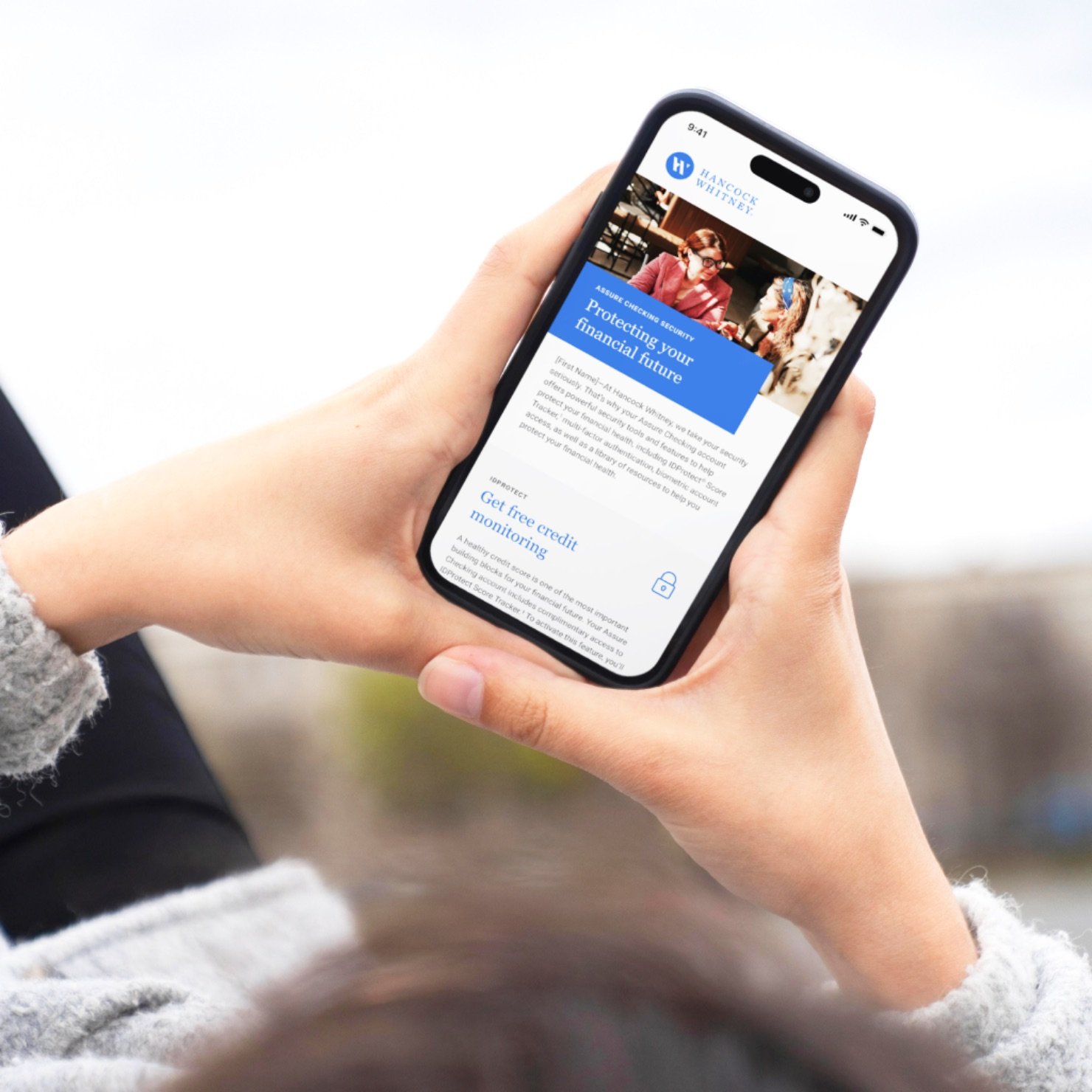A customer using Hancock Whitney on a phone
