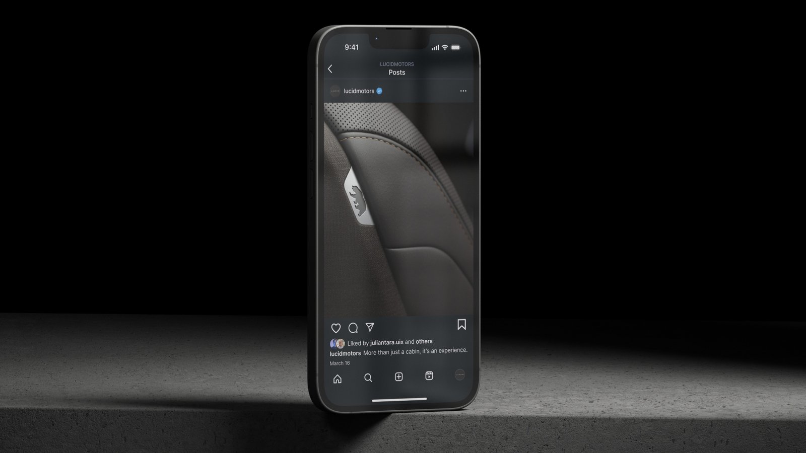 Lucid Air Instagram post on a phone in a dark studio