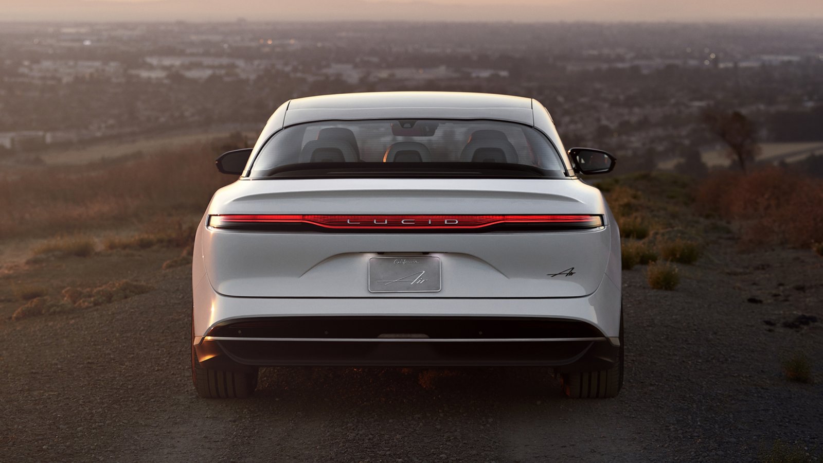 Rear view of a Lucid Air driving through California
